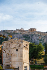 Fototapeta na wymiar Tower of the Wind-gods in Roman Agora and Acropolis in the background