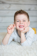 Teenager child with a tooth dropped out