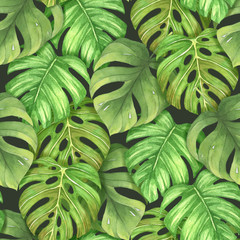 Seamless pattern with tropical leaves watercolor on black background. Hand drawn nature illustration. Perfect for patterned fabric, gift wrap, invitations and greeting cards.