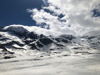 clouds over the mountains Bernina Express Swiss Alps