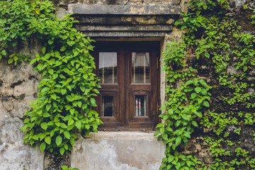 Fototapeta na wymiar Old vintage traditional wooden window and cement wall