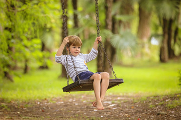 Teen boy on swing