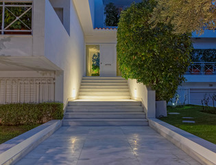 white marble stairs to modern house entrance night view, Athens Greece