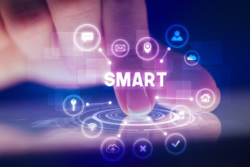 Finger touching tablet with web technology icons and SMART inscription, web technology concept