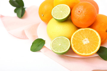 Different citrus fruits on the table. Juicy citrus fruits.