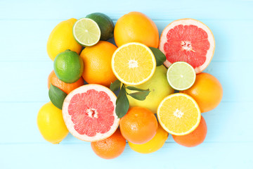 Different citrus fruits on the table. Juicy citrus fruits.