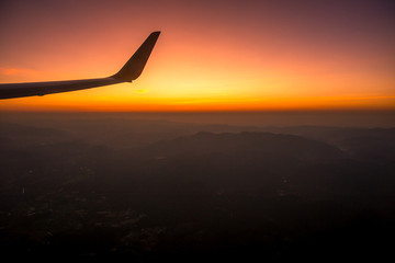 Blurred abstract background of high angle views from the plane window,can see the natural atmosphere during the air travel (mountains,rivers,morning light)