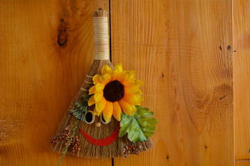 sunflowers in a vase on wooden background