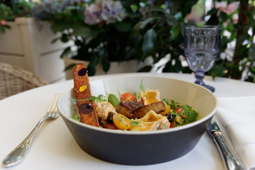 French starter of fried foie gras, camembert and lettuce