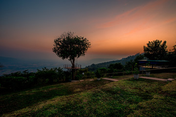 abstract background of nature,a high angle that can see the scenery around (trees,meadows,mountains, the light of the twilight in the evening) and the wind blowing through the large mountains