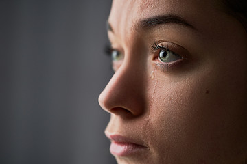 Sad desperate crying woman with tears eyes during trouble, life difficulties, loss and emotional...
