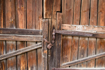 Old gate with a rusty lock. Background for design.