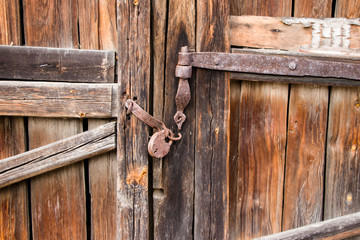 Old gate with a rusty lock. Background for design.