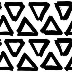 Seamless pattern from triangular figure brushstrokes textured on a white background