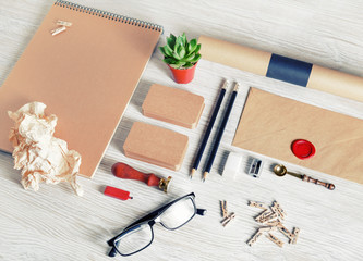 Blank corporate identity template on light wooden background. Photo of kraft stationery set. Mockup...