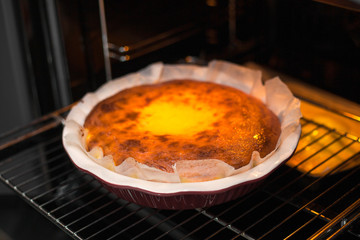 Oven baked cottage cheese casserole. In red baking dish.