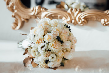 Beautiful modern wedding bouquet on white table. Close up of wedding bouquet