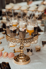 Fototapeta na wymiar Healthy breakfast - Chia seeds pudding. Health care, fitness, diet, super food concept, raw vegetarian dessert. Chia pudding in glass on wedding banquet table.