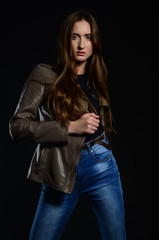 beautiful brunette in the studio on a black background