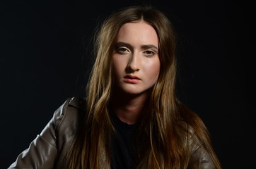 Fototapeta premium beautiful brunette in the studio on a black background