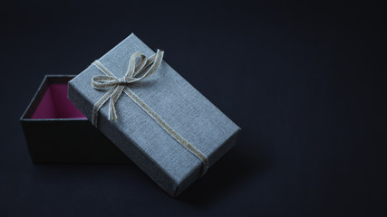 Gift boxes and hearts on a black background