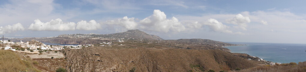 Panoramic view of the city of Akrotiri, an ancient ruined castle, caldera, and the Mediterranean Sea, on the island of Santorini Greece.