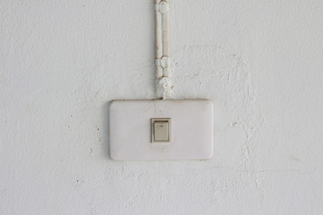 old light switch on the white wall