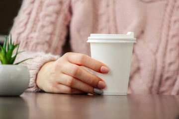 woman holding a cup of coffee