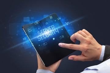 Businessman holding a foldable smartphone with SERVER SECURITY inscription, cyber security concept
