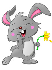 Obraz na płótnie Canvas Cartoon happy rabbit holding flower