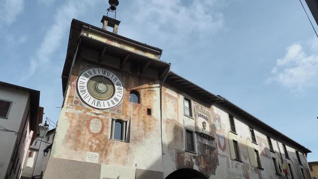 Clusone, Bergamo, Italy. The astronomical or planetary clock and the facade of the town hall. Famous attraction of the city. It has been loaded by hand every day for about four hundred years
