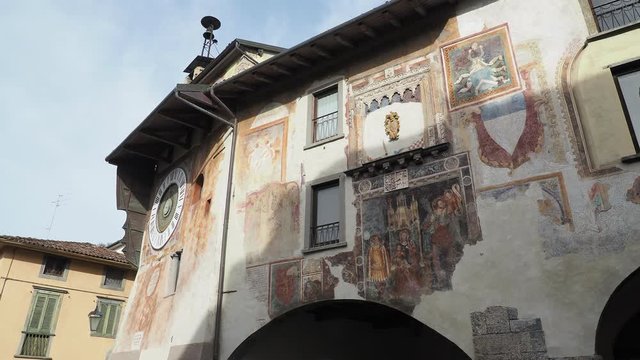 Clusone, Bergamo, Italy. The astronomical or planetary clock and the facade of the town hall. Famous attraction of the city. It has been loaded by hand every day for about four hundred years