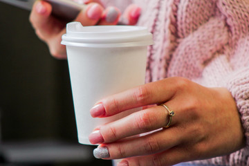 hand with cup of coffee