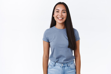 Obraz premium Carefree, cheerful asian brunette female student spend time partying with friends, celebrating winter holidays, laughing and smiling joyfully, showing positive vibe, standing white background