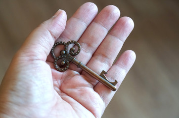 closeup, Hand holding bottle opener kitchen