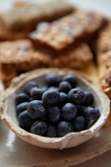 Close up of blackberries. With various energy nutrition bars in background