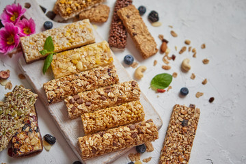 Various kinds of protein granola bars with dry fruits and berries