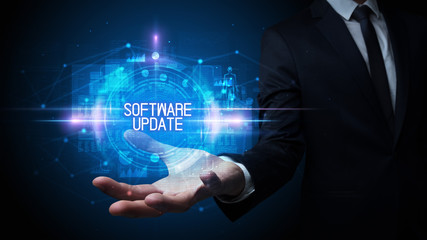 Man hand holding SOFTWARE UPDATE inscription, technology concept