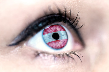 Flag of Austria reflects in a woman blue eye - election, sport, hope, young, generation, pride, dream, emotion, independance	