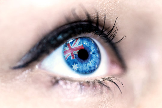 Flag of Australia reflects in a woman blue eye - election, sport, hope, young, generation, pride, dream, emotion, independance	