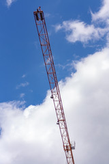 Crane against the sky with cloud. Architectural concept.