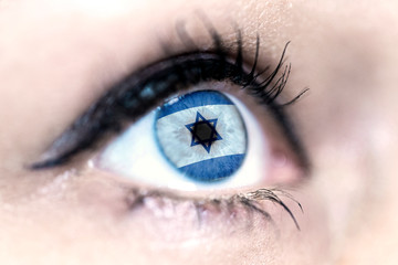 Flag of Israel reflects in a woman blue eye - election, sport, hope, young, generation, pride,...