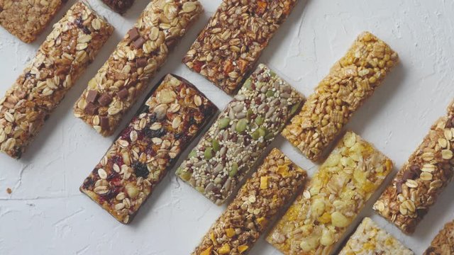 Row of mixed gluten free granola cereal energy bars. With dried fruits and nuts.