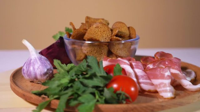Tasty bread crackers, bacon, cherry tomatoes, garlic and parsley