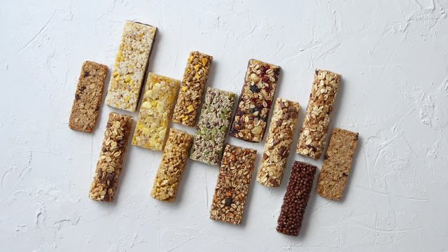 Row of mixed gluten free granola cereal energy bars. With dried fruits and nuts.