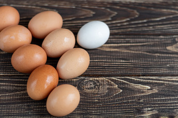 Chicken eggs on a wooden table. Agricultural products, natural eggs. Preparing for Easter.