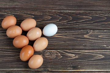 Chicken eggs on a wooden table. Agricultural products, natural eggs. Preparing for Easter.