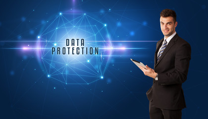 Businessman thinking about security solutions with DATA PROTECTION inscription
