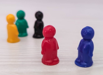 Conception  - partnership, cooperation, game figures or pawns in a business situation. Colored...