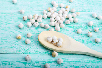 dry chickpeas in a wooden spoon